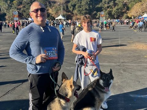 David Coher with his son and their two dogs at a community race